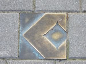 One of several bronze waymarkers to guide you across the centre.